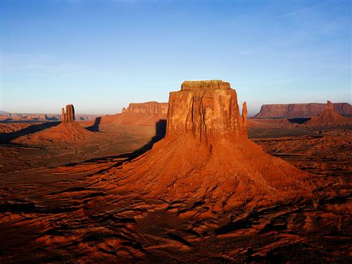 The sun rising over the mesas of the desert. 